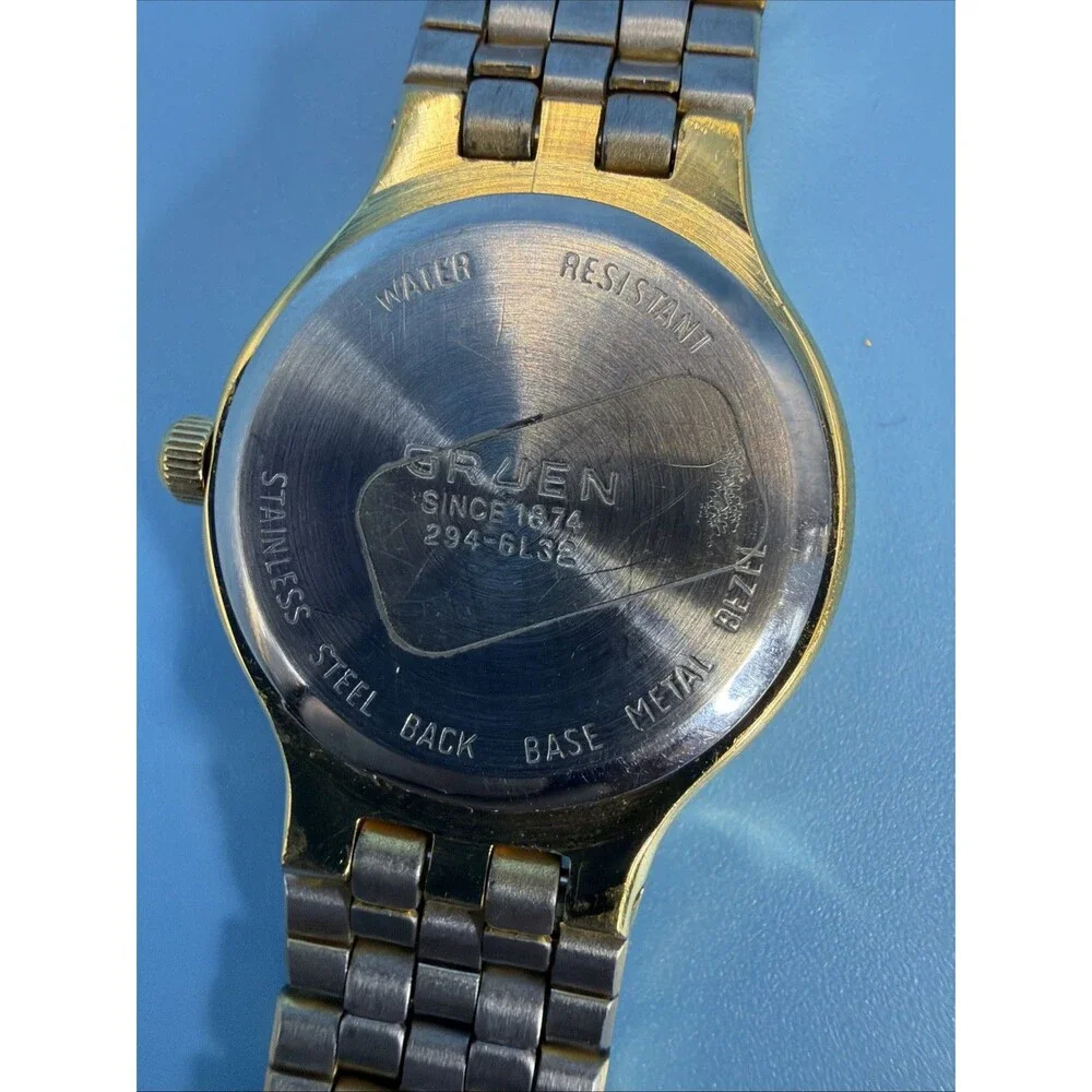 Vintage Gruen Quartz Ladies Gold Tone Black Dial Dainty Elegant Watch Runs Great